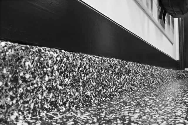 Floor coating and wall finishes support a brighter working room.
