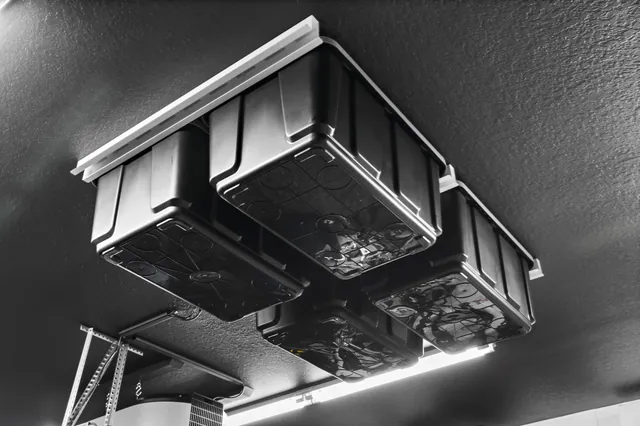 Individual bins held in ceiling-mounted storage rails.