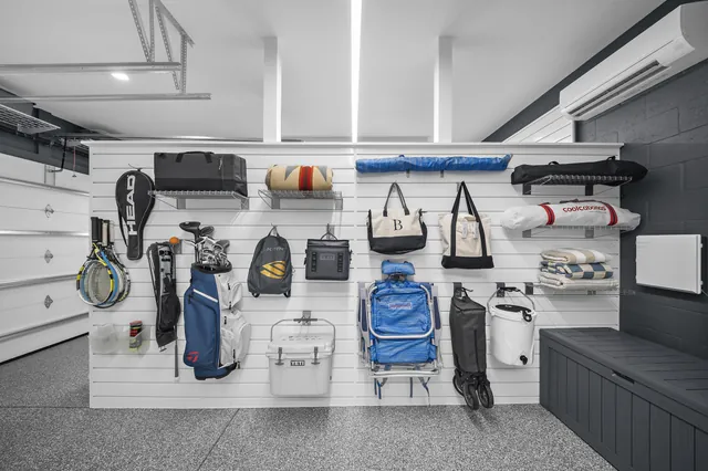 Beach and recreation equipment stored on accessible slatwall accessories.