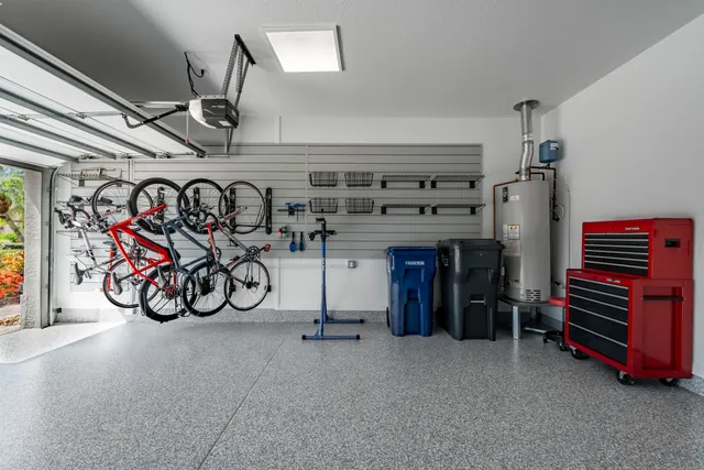 Open floor in front of the bike mounts provides room to take out a bike, with riding and maintenance accessories stored alongside.
