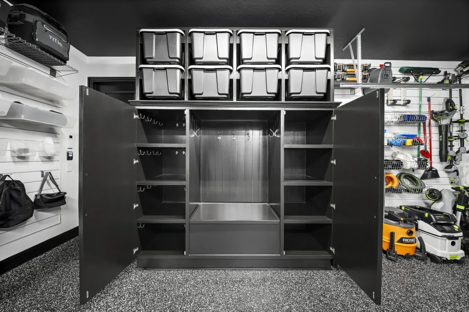 Open drop-zone cabinetry with shelves, hooks, and two rows of bins above.