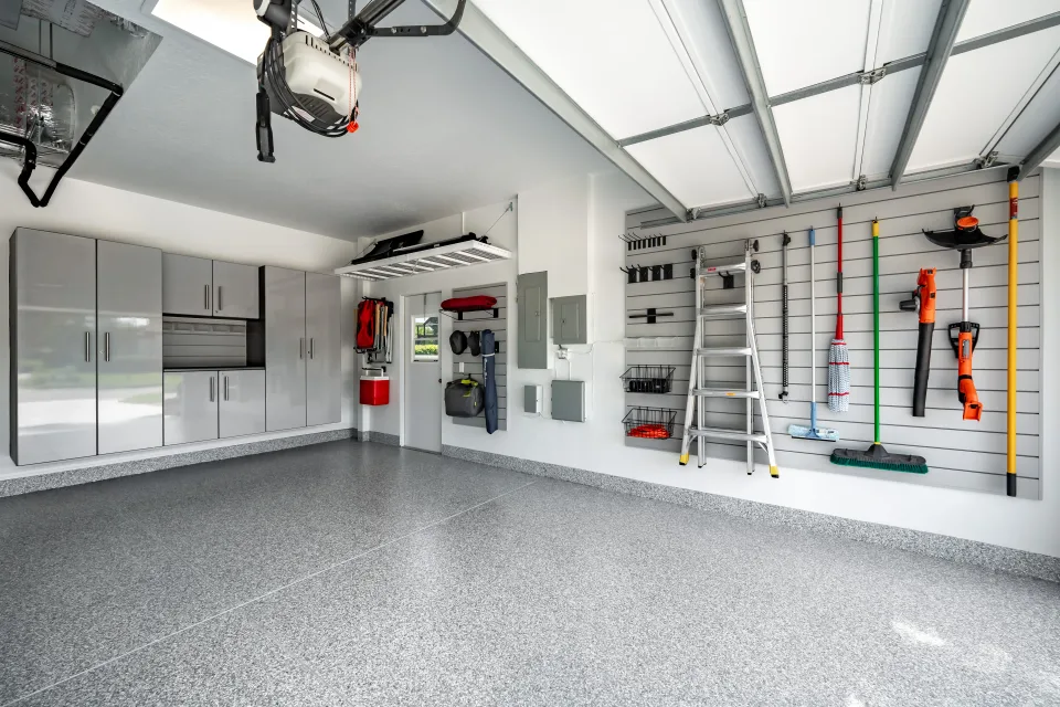 Cabinetry beside an overhead rack, with clear floor space and an unobstructed exterior doorway.